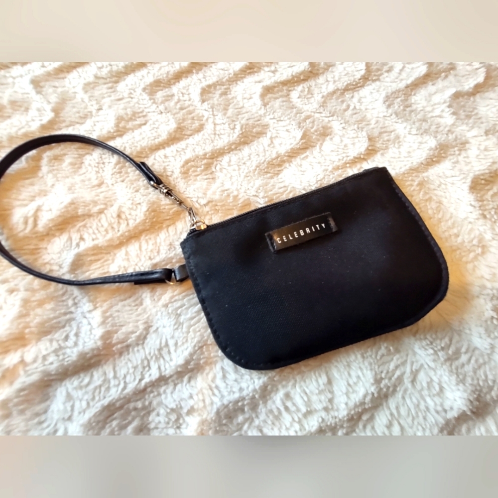 Celebrity Black Zipper Wristlet. Slik polka dot lining.